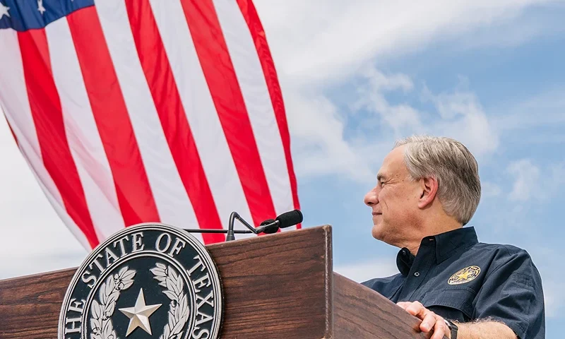 Former President Trump Joins TX Gov. Abbott At Unfinished Border Wall PHARR, TEXAS - JUNE 30: Texas Gov. Greg Abbott listens to former President Donald Trump's address during a tour to an unfinished section of the border wall on June 30, 2021 in Pharr, Texas. Gov. Abbott has pledged to build a state-funded border wall between Texas and Mexico as a surge of mostly Central American immigrants crossing into the United States has challenged U.S. immigration agencies. So far in 2021, U.S. Border Patrol agents have apprehended more than 900,000 immigrants crossing into the United States on the southern border. (Photo by Brandon Bell/Getty Images)