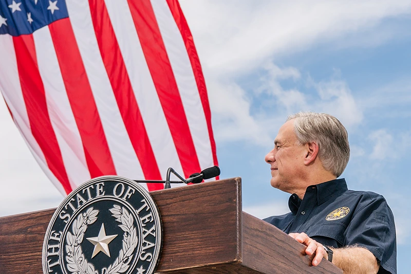 Former President Trump Joins TX Gov. Abbott At Unfinished Border Wall
PHARR, TEXAS - JUNE 30: Texas Gov. Greg Abbott listens to former President Donald Trump's address during a tour to an unfinished section of the border wall on June 30, 2021 in Pharr, Texas. Gov. Abbott has pledged to build a state-funded border wall between Texas and Mexico as a surge of mostly Central American immigrants crossing into the United States has challenged U.S. immigration agencies. So far in 2021, U.S. Border Patrol agents have apprehended more than 900,000 immigrants crossing into the United States on the southern border. (Photo by Brandon Bell/Getty Images)