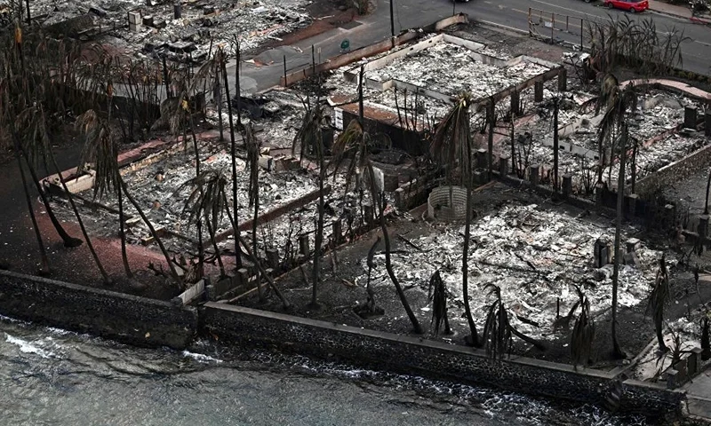 An aerial image taken on August 10, 2023 shows destroyed homes and buildings burned to the ground in Lahaina in the aftermath of wildfires in western Maui, Hawaii. At least 36 people have died after a fast-moving wildfire turned Lahaina to ashes, officials said August 9, 2023 as visitors asked to leave the island of Maui found themselves stranded at the airport. The fires began burning early August 8, scorching thousands of acres and putting homes, businesses and 35,000 lives at risk on Maui, the Hawaii Emergency Management Agency said in a statement. (Photo by Patrick T. Fallon / AFP) (Photo by PATRICK T. FALLON/AFP via Getty Images)