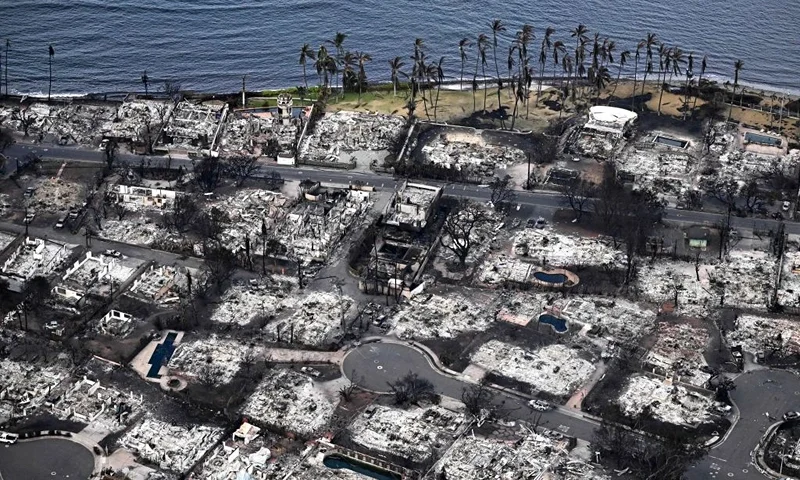 An aerial image taken on August 10, 2023 shows destroyed homes and buildings burned to the ground in Lahaina in the aftermath of wildfires in western Maui, Hawaii. At least 36 people have died after a fast-moving wildfire turned Lahaina to ashes, officials said August 9, 2023 as visitors asked to leave the island of Maui found themselves stranded at the airport. The fires began burning early August 8, scorching thousands of acres and putting homes, businesses and 35,000 lives at risk on Maui, the Hawaii Emergency Management Agency said in a statement. (Photo by Patrick T. Fallon / AFP) (Photo by PATRICK T. FALLON/AFP via Getty Images)
