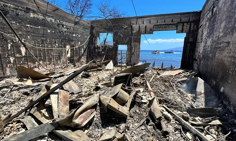 TOPSHOT-US-FIRE-HAWAII TOPSHOT - Destroyed buildings and homes are pictured in the aftermath of a wildfire in Lahaina, western Maui, Hawaii on August 11, 2023. A wildfire that left Lahaina in charred ruins has killed at least 55 people, authorities said on August 10, making it one of the deadliest disasters in the US state's history. Brushfires on Maui, fueled by high winds from Hurricane Dora passing to the south of Hawaii, broke out August 8 and rapidly engulfed Lahaina. (Photo by Sébastien VUAGNAT / AFP) (Photo by SEBASTIEN VUAGNAT/AFP via Getty Images)