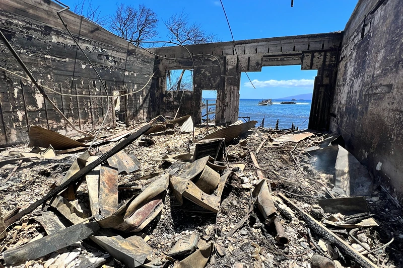 TOPSHOT-US-FIRE-HAWAII
TOPSHOT - Destroyed buildings and homes are pictured in the aftermath of a wildfire in Lahaina, western Maui, Hawaii on August 11, 2023. A wildfire that left Lahaina in charred ruins has killed at least 55 people, authorities said on August 10, making it one of the deadliest disasters in the US state's history. Brushfires on Maui, fueled by high winds from Hurricane Dora passing to the south of Hawaii, broke out August 8 and rapidly engulfed Lahaina. (Photo by Sébastien VUAGNAT / AFP) (Photo by SEBASTIEN VUAGNAT/AFP via Getty Images)
