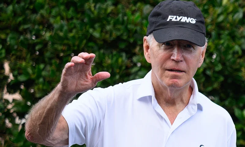 US-POLITICS-BIDEN-CYCLING US President Joe Biden waves as he returns to a car after visiting the beach near his vacation home in Rehoboth Beach, Delaware on August 13, 2023. (Photo by Mandel NGAN / AFP) (Photo by MANDEL NGAN/AFP via Getty Images)