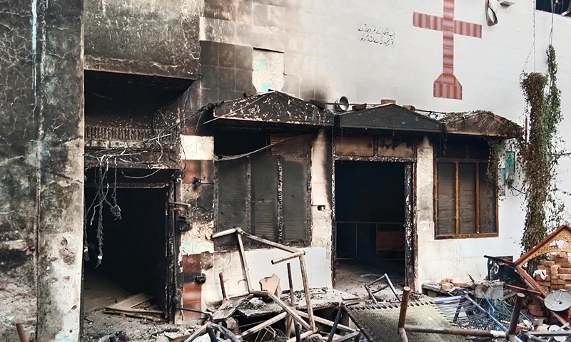 TOPSHOT - View of a burnt church on the outskirts of Faisalabad on August 16, 2023, following an attack by Muslim men after a Christian family was accused of blasphemy. Hundreds of Muslim men set fire to four churches and vandalised a cemetery during a rampage in eastern Pakistan on August 16, officials said, after a Christian family was accused of blasphemy. (Photo by Ghazanfar MAJID / AFP) (Photo by GHAZANFAR MAJID/AFP via Getty Images)