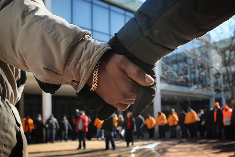 Anti-Gun Violence March Held From School To Park Where Teenage Girl Killed Earlier In Week
CHICAGO, IL - FEBRUARY 01: Students and community leaders pray before leaving from Dr. Martin Luther King Jr. College Prep High School to distribute flyers which ask for help in finding the killer of Hadiya Pendleton on February 1, 2013 in Chicago, Illinois. Pendleton, a fifteen-year-old honor student at King School, was shot and killed while hanging out with friends on a rainy afternoon under a shelter in Harsh Park on January 29. A $30,000 reward has been raised to help find her killer. (Photo by Scott Olson/Getty Images)