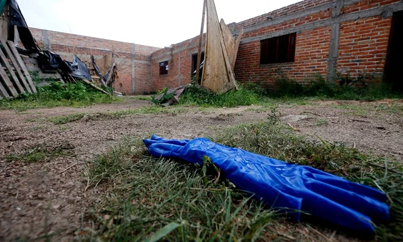 Gloves are seen in the house where allegedly five young men were murdered in Lagos de Moreno, Jalisco State, Mexico, on August 17, 2023. Mexican authorities said Thursday that they had discovered human remains during a search for five young men whose disappearance and apparent brutal murder prompted shock and anger. The group of five friends, aged 19 to 22, disappeared last Friday in the western state of Jalisco, triggering a rare level of outrage in a country where kidnappings and killings are all too common. (Photo by ULISES RUIZ / AFP) (Photo by ULISES RUIZ/AFP via Getty Images)