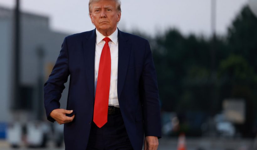ATLANTA, GEORGIA - AUGUST 24: Former U.S. President Donald Trump arrives to depart at Atlanta Hartsfield-Jackson International Airport after being booked at the Fulton County jail on August 24, 2023 in Atlanta, Georgia. Trump was booked on multiple charges related to an alleged plan to overturn the results of the 2020 presidential election in Georgia. (Photo by Joe Raedle/Getty Images)