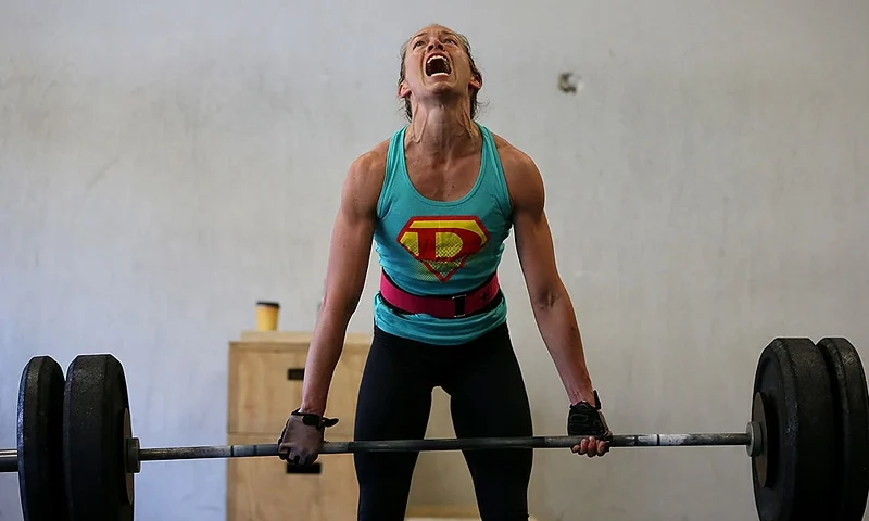 SAN ANSELMO, CA - MARCH 14: A class participant does a deadlift during a CrossFit workout at Ross Valley CrossFit on March 14, 2014 in San Anselmo, California. CrossFit, a high intensity workout regimen that is a constantly varied mix of aerobic exercise, gymnastics and Olympic weight lifting, is one of the fastest growing fitness programs in the world. The grueling cult-like core strength and conditioning program is popular with firefighters, police officers, members of the military and professional athletes. Since its inception in 2000, the number of CrossFit affiliates, or "boxes" has skyrocketed to over 8,500 worldwide with more opening every year. (Photo by Justin Sullivan/Getty Images)