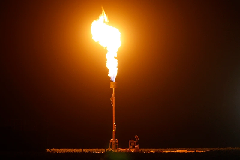 Fracking In California Under Spotlight As Some Local Municipalities Issue Bans
BUTTONWILLOW, CA - MARCH 22: Gas is flared as waste from the Monterey Shale formation where gas and oil extraction using hydraulic fracturing, or fracking, is on the verge of a boom on March 22, 2014 near Buttonwillow, California. Critics of fracking in California cite concerns over water usage and possible chemical pollution of ground water sources as California farmers are forced to leave unprecedented expanses of fields fallow in one of the worst droughts in California history. Concerns also include the possibility of earthquakes triggered by the fracking process which injects water, sand and various chemicals under high pressure into the ground to break the rock to release oil and gas for extraction though a well. The 800-mile-long San Andreas Fault runs north and south on the western side of the Monterey Formation in the Central Valley and is thought to be the most dangerous fault in the nation. Proponents of the fracking boom saying that the expansion of petroleum extraction is good for the economy and security by developing more domestic energy sources and increasing gas and oil exports. (Photo by David McNew/Getty Images)