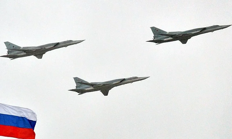 Russian Tupolev Tu-22M supersonic strategic bombers fly above the Kremlin in Moscow, on May 7, 2014, during a rehearsal of the Victory Day parade. Russia celebrates the1945 victory over Nazi Germany on May 9. AFP PHOTO / YURI KADOBNOV (Photo credit should read YURI KADOBNOV/AFP via Getty Images)