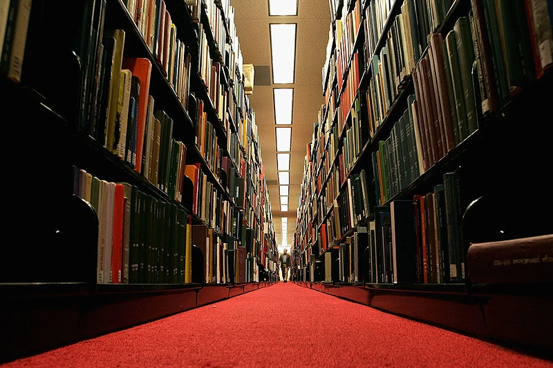 STANFORD, CA - DECEMBER 17: A man browses through books at the Cecil H. Green on the Stanford University Campus December 17, 2004 in Stanford, California. Google, the internet search engine, has announced a long-term project to put 15 million books from seven of the world's most prestigious libraries online and make them searchable. Included will be the libraries of Harvard, Stanford, the University of Michigan, the New York Public Library and the University of Oxford, including the Bodleian. Books and periodicals will be scanned and project is expected to take six years and cost more than $100 million. (Photo by Justin Sullivan/Getty Images)