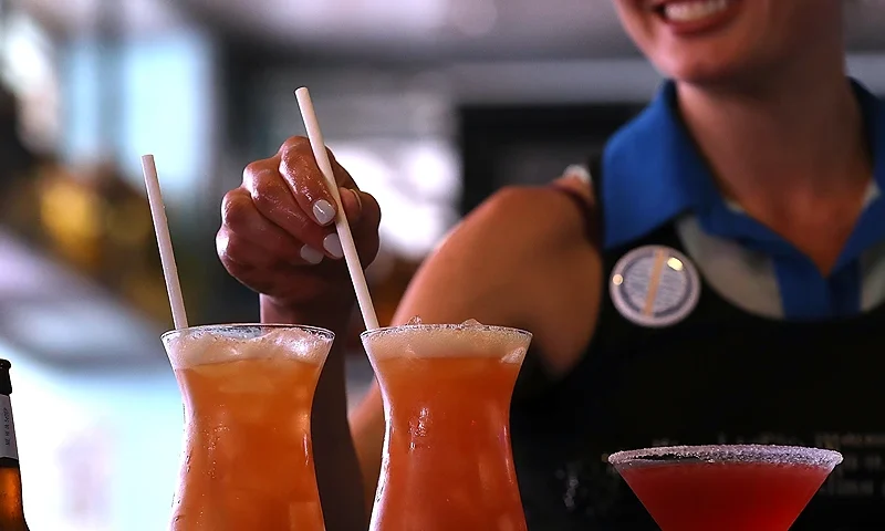 SAN FRANCISCO, CA - JUNE 21: A bartender at Wipeout Bar & Grill makes cocktails that have paper straws on June 21, 2018 in San Francisco, California. San Francisco, Oakland and Berkeley are all considering bans on plastic straws but are facing the difficult challenge of finding suppliers that make paper straws. Aardvark Straws, one of a few paper straw manufacturers in the United States, has seen a 5000 percent surge in sales over the past two years and currently is about two months behind on production. (Photo by Justin Sullivan/Getty Images)