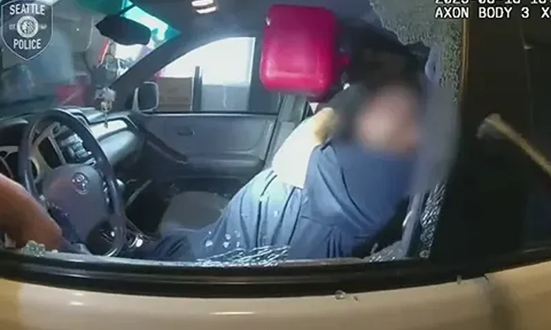 The suspect refused to obey officers' commands to leave the vehicle and instead began to guzzle gasoline from a can, authorities said. (Seattle Police Department)
