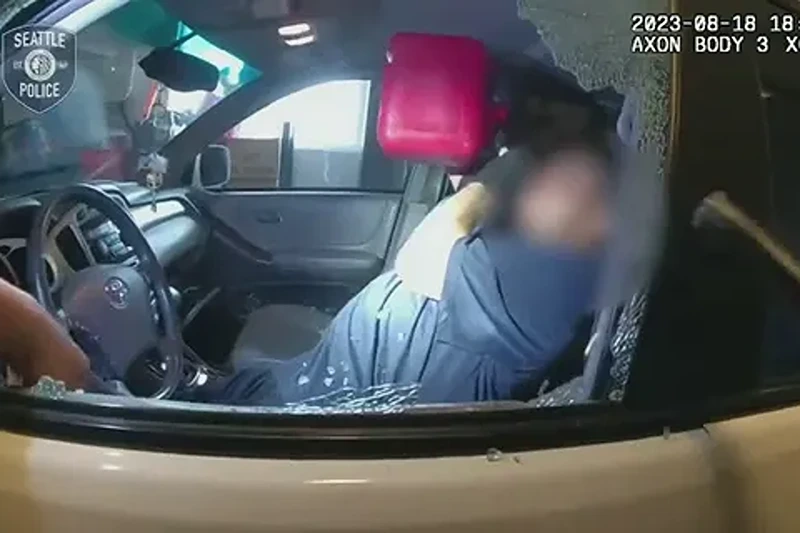 The suspect refused to obey officers' commands to leave the vehicle and instead began to guzzle gasoline from a can, authorities said. (Seattle Police Department)