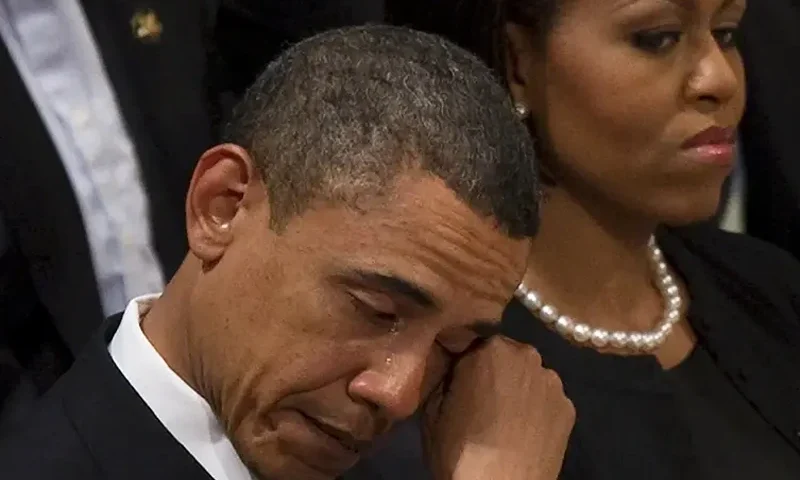 US President Barack Obama wipes away a tear as he sits next to First Lady Michelle Obama at the funeral service for Dr Dorothy Height at Washington National Cathedral in Washington, DC, April 29, 2010. Height, who led the National Council for Negro Women for four decades, and was present at the key battles for racial equality since the 1930s, died at age 98 after a lifetime devoted to the fight for equality. AFP PHOTO/Jim WATSON (Photo credit should read JIM WATSON/AFP via Getty Images)