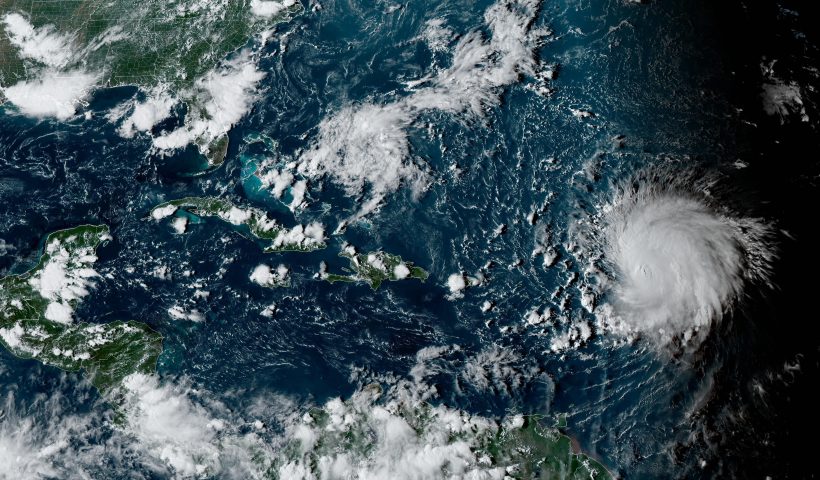 This satellite image provided by the National Oceanographic and Atmospheric Administration shows Hurricane Lee, right, in the Atlantic Ocean on Friday, Sept. 8, 2023, at 4:50 p.m. EDT. (NOAA via AP)