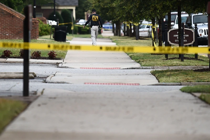 Us-crime-virginia-shooting
An FBI agent work on June 1, 2019, at the scene of the mass shooting in the Virginia Beach Municipal center in Virginia, Beach, Virginia. - A municipal employee sprayed gunfire "indiscriminately" in the government building complex on May 31, 2019, police said, killing 12 people and wounding four in the latest mass shooting to rock the US. (Photo by Eric BARADAT / AFP) (Photo credit should read ERIC BARADAT/AFP via Getty Images)