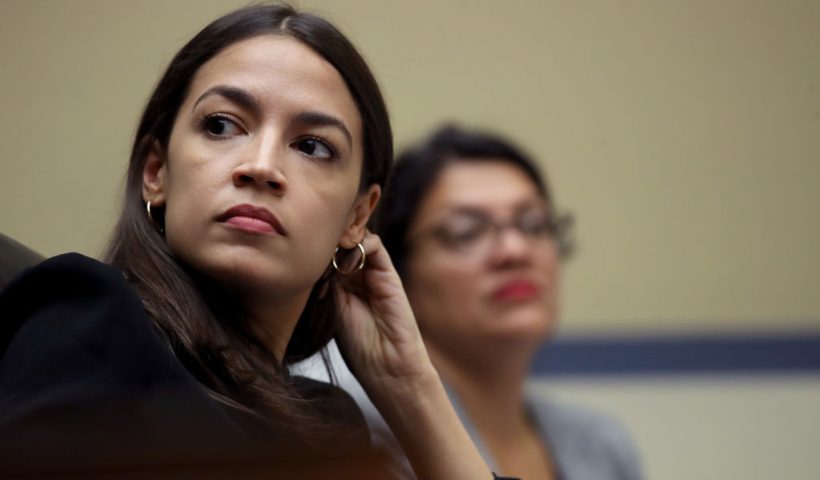 WASHINGTON, DC - JULY 18: Rep. Alexandria Ocasio-Cortez (L) (D-NY) and Rep. Rashida Tlaib (D-MI) listen to testimony from acting Homeland Security Secretary Kevin McAleenan while he testifies before the House Oversight and Reform Committee on July 18, 2019 in Washington, DC. The hearing is on "The Trump Administration's Child Separation Policy." (Photo by Win McNamee/Getty Images)