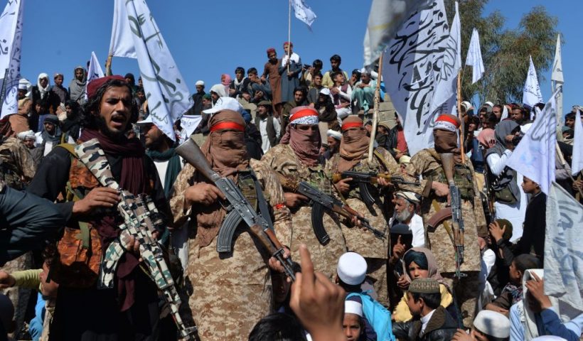 TOPSHOT - Afghan Taliban militants and villagers attend a gathering as they celebrate the peace deal and their victory in the Afghan conflict on US in Afghanistan, in Alingar district of Laghman Province on March 2, 2020. - The Taliban said on March 2 they were resuming offensive operations against Afghan security forces, ending the partial truce that preceded the signing of a deal between the insurgents and Washington. (Photo by NOORULLAH SHIRZADA / AFP) (Photo by NOORULLAH SHIRZADA/AFP via Getty Images)