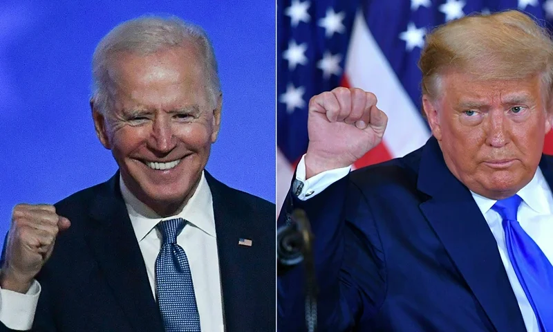 TOPSHOT-COMBO-US-VOTE-TRUMP-BIDEN TOPSHOT - (COMBO) This combination of pictures created on November 04, 2020 shows Democratic presidential nominee Joe Biden (L) in Wilmington, Delaware, and US President Donald Trump (R) in Washington, DC both pumping their fist during an election night speech early November 4, 2020. President Donald Trump and Democratic challenger Joe Biden are battling it out for the White House, with polls closed across the United States -- and the American people waiting for results in key battlegrounds still up for grabs, one day after the US presidential election November 03. (Photo by ANGELA WEISS and MANDEL NGAN / AFP) (Photo by ANGELA WEISS,MANDEL NGAN/AFP via Getty Images)