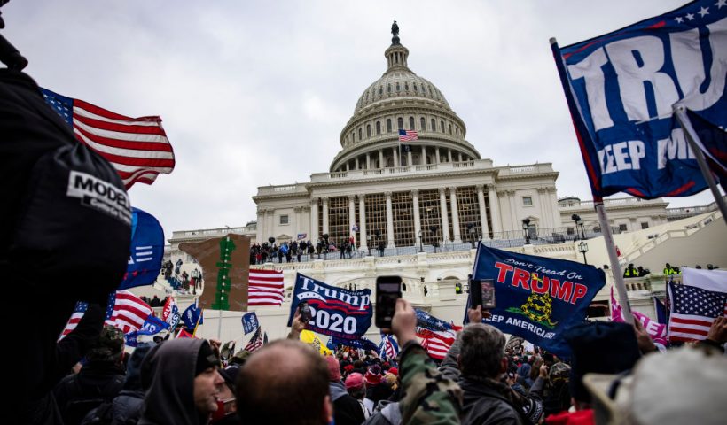 WASHINGTON, DC - JANUARY 06: Pro-Trump supporters storm the U.S. Capitol following a rally with President Donald Trump on January 6, 2021 in Washington, DC. Trump supporters gathered in the nation's capital today to protest the ratification of President-elect Joe Biden's Electoral College victory over President Trump in the 2020 election. (Photo by Samuel Corum/Getty Images)
