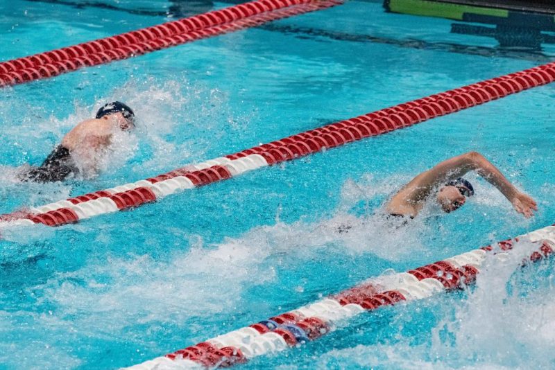 Transgender swimmer Lia Thomas (R) of Penn University and transgender swimmer Iszac Henig (L) of Yale compete in the 100-yard freestyle swimming race at the 2022 Ivy League Women's Swimming & Diving Championships at Harvard University in Cambridge, Massachusetts on February 19, 2022. - Thomas took first place with a time of 47.63 and Henig took second place with a time of 47.82. (Photo by Joseph Prezioso / AFP) (Photo by JOSEPH PREZIOSO/AFP via Getty Images)