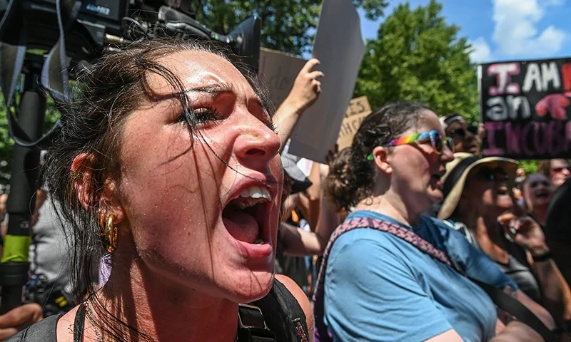 A protester shouts in front of the US Supreme Court in Washington, DC, on June 25, 2022, a day after the Supreme Court released a decision on Dobbs v Jackson Women's Health Organization, striking down the right to abortion. - Abortion rights supporters prepared to fan out across America Saturday for a second day of protest against the Supreme Court's thunderbolt ruling, as state after conservative state moved swiftly to ban the procedure. (Photo by ROBERTO SCHMIDT / AFP) (Photo by ROBERTO SCHMIDT/AFP via Getty Images)