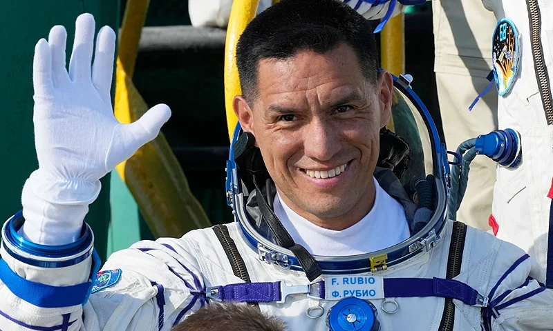 KAZAKHSTAN-RUSSIA-US-SPACE-ISS NASA astronaut Frank Rubio, a member of the International Space Station (ISS) Expedition 68 main crew, waves as he boards the Soyuz MS-22 spacecraft prior to the launch at the Russian leased Baikonur cosmodrome in Kazakhstan on September 21, 2022. - Expedition 68 astronaut Frank Rubio of NASA, and cosmonauts Sergey Prokopyev and Dmitri Petelin of Roscosmos are scheduled to launch aboard their Soyuz MS-22 spacecraft on September 21. (Photo by Dmitry LOVETSKY / POOL / AFP) (Photo by DMITRY LOVETSKY/POOL/AFP via Getty Images)
