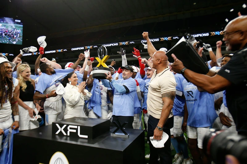 SAN ANTONIO, TX - MAY 13 : Head coach Bob Stoops of the Arlington Renegades celebrates with the trophy after defeating DC Defenders in XFL Championship game at the Alamodome on May 13 2023 in San Antonio, Texas. (Photo by Ronald Cortes/Getty Images)
