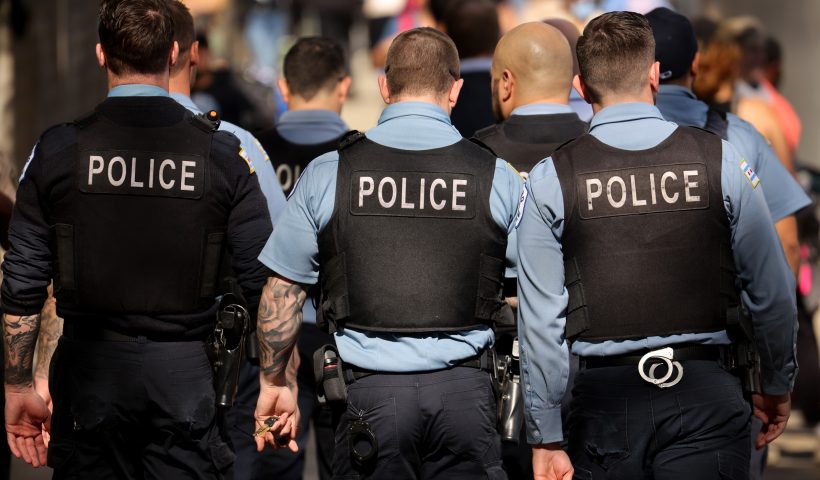Chicago Police Clash With Mayor Over Vaccine Mandates CHICAGO, ILLINOIS - OCTOBER 19: Chicago police officers patrol downtown as the city celebrates the Chicago Sky's WNBA title on October 19, 2021 in Chicago, Illinois. The city has started to place police officers on unpaid leave for refusing to comply with the city's requirements that they report their COVID-19 vaccination status. Only about 65 percent of the city's police have complied with the order. (Photo by Scott Olson/Getty Images)