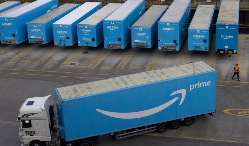 LONDON, ENGLAND - DECEMBER 13: Amazon Prime lorries are seen at the Amazon fulfilment centre on December 13, 2021 in London, England. In September, the e-commerce giant announced it would seek to fill 20,000 seasonal positions this year across the United Kingdom, bolstering its workforce in fulfilment centres, sort centres and delivery stations amid peak trading times, including Christmas. (Photo by Dan Kitwood/Getty Images)