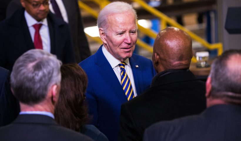NEW YORK, NEW YORK - JANUARY 31: U.S. President Joe Biden speaks with New York City Mayor Eric Adams after giving a speech on infrastructure at the West Side Yard on January 31, 2023 in New York City. President Biden traveled to New York to speak about how the passage of the the bipartisan infrastructure law will help fund the Hudson River tunnel project and improve reliability for the 200,000 passenger trips per weekday on Amtrak and NJ Transit. (Photo by Michael M. Santiago/Getty Images)