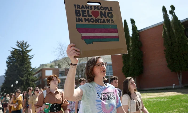 MISSOULA, MONTANA - MAY 03: Transgender rights activists hold signs as they march through the University of Montana campus on May 03, 2023 in Missoula, Montana. Dozens of students and transgender rights activists staged a demonstration on the University of Montana campus to protest the censure of transgender Montana state Rep. Zooey Zephyr by House Republicans in the Montana State Legislature for breaking House rules of decorum by saying state legislators would have "blood on your hands" if a transgender youth care ban was passed. (Photo by Justin Sullivan/Getty Images)