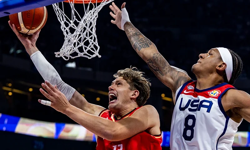 USA v Germany: Semi Final - FIBA Basketball World Cup MANILA, PHILIPPINES - SEPTEMBER 08: Moritz Wagner #13 of Germany drives to the basket against Paolo Banchero #8 of the United States during the FIBA Basketball World Cup Semi Final game between USA and Germany at Mall of Asia Arena on September 08, 2023 in Manila, Philippines. (Photo by Ezra Acayan/Getty Images)