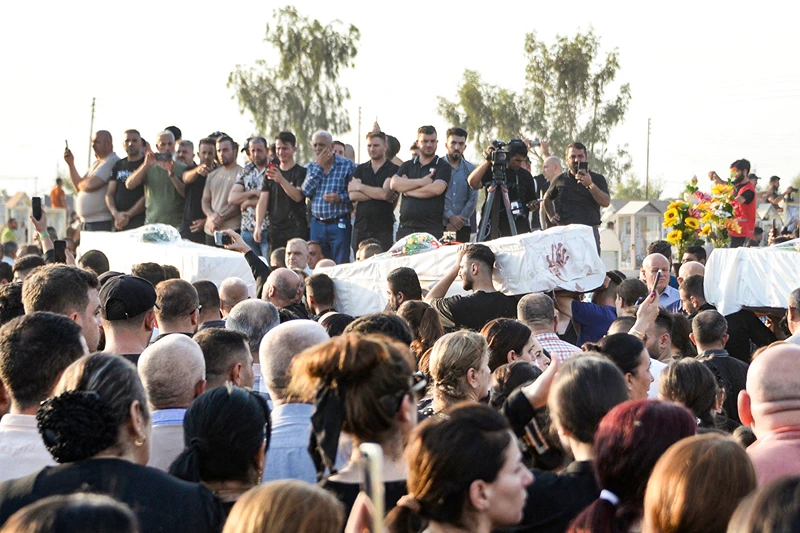 IRAQ-FIRE-FUNERAL
Mourners attend the funeral of victims who were killed when a fire ripped through a crowded wedding hall in the mainly Christian northern city of Qaraqosh, also known as Hamdaniyah, on September 27, 2023. At least 100 people were killed when a fire ripped through a crowded Iraqi wedding hall, officials said, pointing to indoor fireworks as the likely cause for the blaze that sparked a panicked stampede for the exits. (Photo by Zaid AL-OBEIDI / AFP) (Photo by ZAID AL-OBEIDI/AFP via Getty Images)