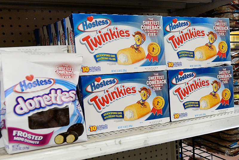 PICO RIVERA, CA - JULY 15: Hostess Twinkie snack cakes and Donettes are on display at a store July 15, 2013 in Pico Rivera, California. Twinkies returned to store shelves after Hostess filed for Chapter 11 bankruptcy late last year, after years of management turmoil and a standoff with its second-biggest union. The company sold off its various brands, with Twinkies and other Hostess cakes going to private equity firms Apollo Global Management and Metropoulos & Co. (Photo by Kevork Djansezian/Getty Images)