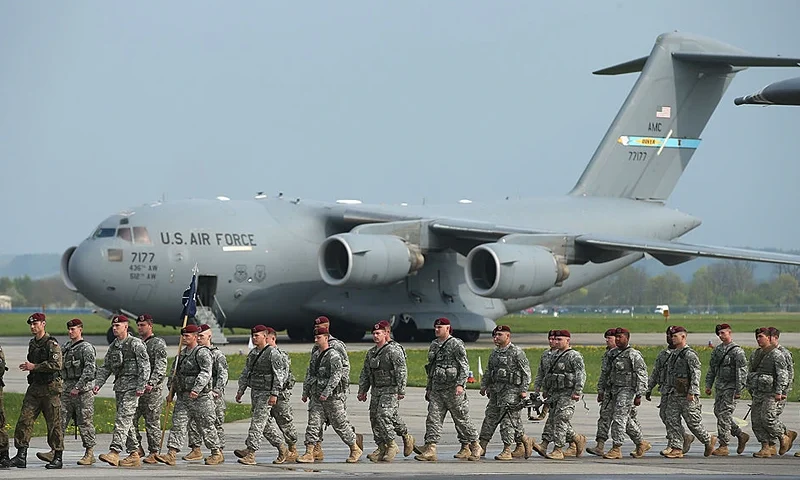 SWIDWIN, POLAND - APRIL 23: Members of the U.S. Army 173rd Airborne Brigade disembark upon their arrival by plane at a Polish air force base on April 23, 2014 in Swidwin, Poland. Approximately 150 U.S. troops, as well as another 450 destined for the three Baltic states in coming days, will participate in bilateral military exercises over the coming weeks in a sign of commitment among NATO members. Tensions are rising in eastern Ukraine between Russian separatists and Ukrainian authorities and NATO is seeking to reassure its own members located close to Russia. (Photo by Sean Gallup/Getty Images)