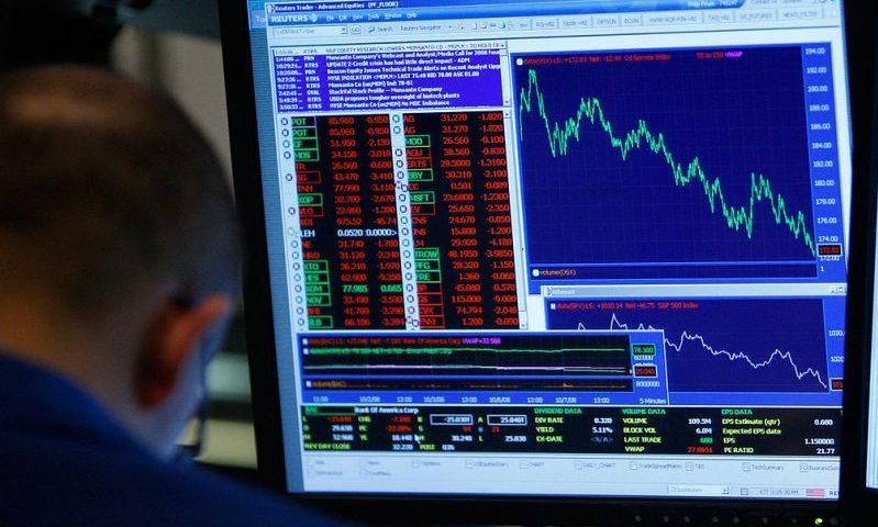 NEW YORK - OCTOBER 07: A trader works on the floor of the New York Stock Exchange October 7, 2008 in New York City. Despite a government debt buyout plan, the Dow continued to fall today, closing more than 500 points down. (Photo by Mario Tama/Getty Images)