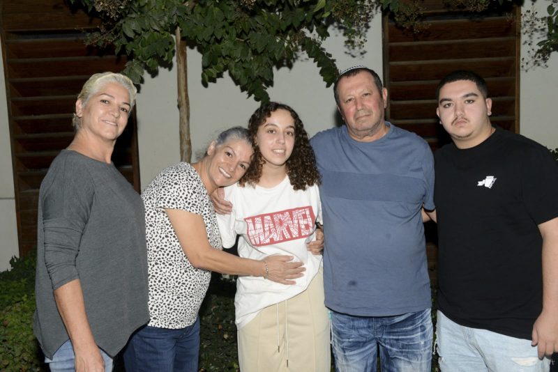 This undated photo provided by the Israeli Security Agency on Monday, Oct. 30, 2023, shows Israeli soldier Pvt. Ori Megidish, center, with relatives. On Monday, the Israeli army said that Megidish was freed from Hamas captivity during Israel's ground offensive in the Gaza Strip. Megidish was among over 230 people taken hostage in Hamas' bloody Oct. 7 cross-border raid. (Israeli Security Agency via AP)