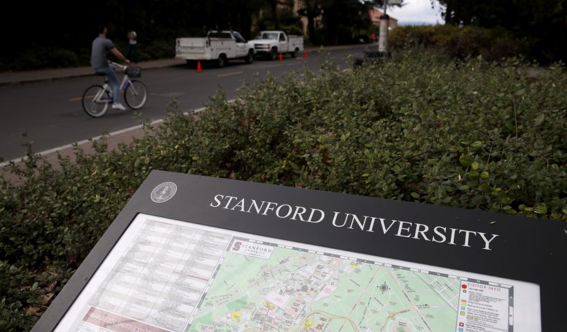 More Than 30 People Charged In Elite College Entry Bribery Scheme STANFORD, - MARCH 12: A cyclist rides by a map of the Stanford University campus on March 12, 2019 in Stanford, California. More than 40 people, including actresses Lori Loughlin and Felicity Huffman, have been charged in a widespread elite college admission bribery scheme. Parents, ACT and SAT administrators and coaches at universities including Stanford, Georgetown, Yale, and the University of Southern California have been charged. (Photo by Justin Sullivan/Getty Images)