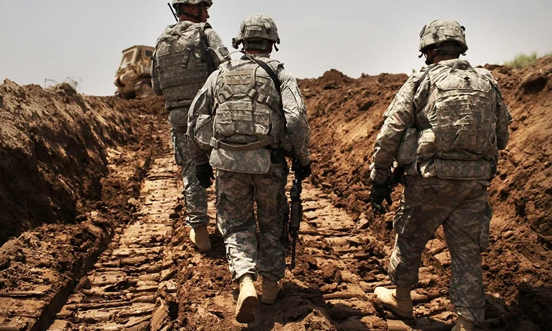 Remaining US Troops In Iraq Patrol Restive Babil Province ISKANDARIYA, IRAQ - JULY 19: U.S. soldiers with the 3rd Armored Cavalry Regiment patrol a new ditch they have dug to protect the base from attack on July 19, 2011 in Iskandariya, Babil Province Iraq. As the deadline for the departure of the remaining American forces in Iraq approaches, Iraqi politicians have agreed to meet in two weeks time in order to give a final decision about extending the U.S. troops' presence beyond the end of the 2011 deadline. Violence against foreign troops has recently picked-up with June being the worst month in combat-related deaths for the military in Iraq in more than two years. Currently about 46,000 U.S. soldiers remain in Iraq. (Photo by Spencer Platt/Getty Images)