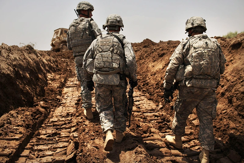 Remaining US Troops In Iraq Patrol Restive Babil Province
ISKANDARIYA, IRAQ - JULY 19: U.S. soldiers with the 3rd Armored Cavalry Regiment patrol a new ditch they have dug to protect the base from attack on July 19, 2011 in Iskandariya, Babil Province Iraq. As the deadline for the departure of the remaining American forces in Iraq approaches, Iraqi politicians have agreed to meet in two weeks time in order to give a final decision about extending the U.S. troops' presence beyond the end of the 2011 deadline. Violence against foreign troops has recently picked-up with June being the worst month in combat-related deaths for the military in Iraq in more than two years. Currently about 46,000 U.S. soldiers remain in Iraq. (Photo by Spencer Platt/Getty Images)