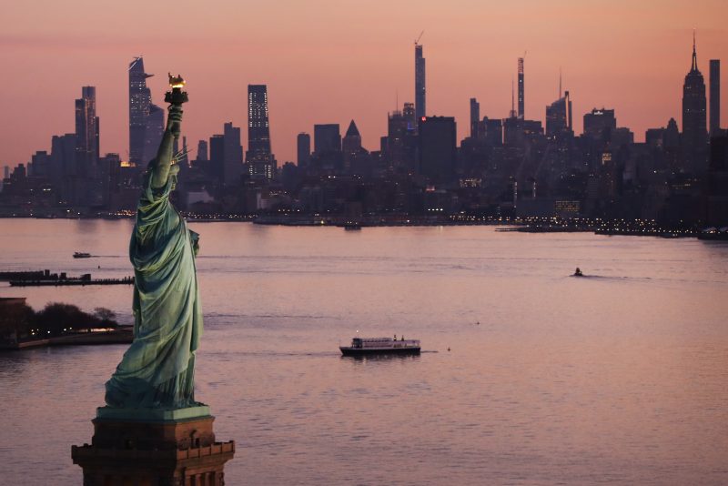 NEW YORK, NEW YORK - MARCH 18: Dawn breaks over The Statue of Liberty as Manhattan and the nation struggles to contain the number of coronavirus cases on March 18, 2020 in New York City. Across the city businesses, schools and places of work have been shutting down leading to empty streets and quiet neighborhoods. New York City mayor Bill de Blasio has threatened to call for a 'shelter-in-place' order as Manhattan continues to see a rise in cases of the virus. World wide, 200,000 people have now contracted COVID-19. (Photo by Spencer Platt/Getty Images)