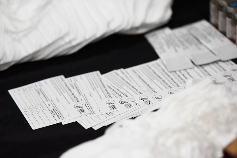 Seized counterfeit CDC Covid-19 vaccination record cards, N95 masks, and unapproved pharmaceuticals are displayed during an opening ceremony for a US Customs and Border Protection (CBP) air dedicated centralized examination station with Custom Specialized Services at Los Angeles International Airport (LAX) on September 16, 2021 in Los Angeles, California. - The new 40,000 sq foot facility is designed to expedite the screening of e-commerce shipments and cargo while intercepting illicit goods including counterfeit products and narcotics through a combination of new scanner technology and CBP officer inspections. (Photo by Patrick T. FALLON / AFP) (Photo by PATRICK T. FALLON/AFP via Getty Images)