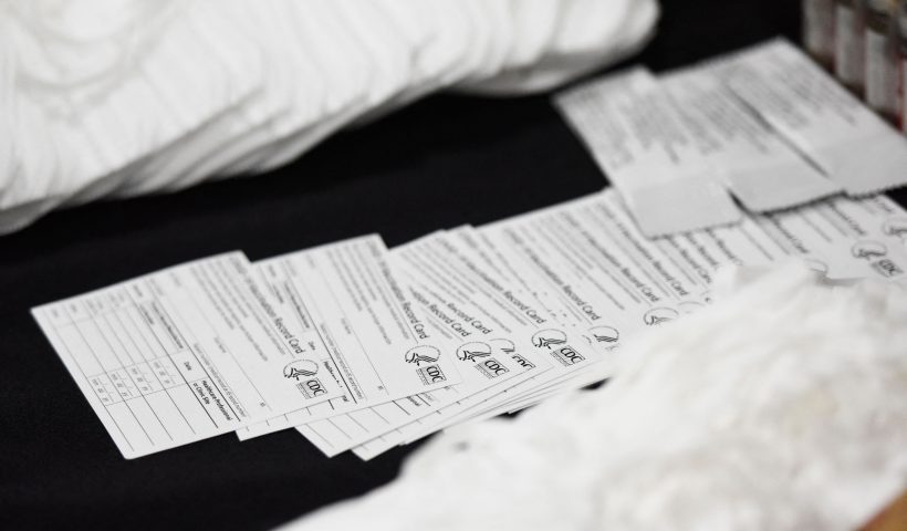 Seized counterfeit CDC Covid-19 vaccination record cards, N95 masks, and unapproved pharmaceuticals are displayed during an opening ceremony for a US Customs and Border Protection (CBP) air dedicated centralized examination station with Custom Specialized Services at Los Angeles International Airport (LAX) on September 16, 2021 in Los Angeles, California. - The new 40,000 sq foot facility is designed to expedite the screening of e-commerce shipments and cargo while intercepting illicit goods including counterfeit products and narcotics through a combination of new scanner technology and CBP officer inspections. (Photo by Patrick T. FALLON / AFP) (Photo by PATRICK T. FALLON/AFP via Getty Images)