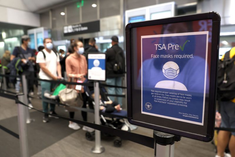 SAN FRANCISCO, CALIFORNIA - APRIL 19: A sign stating that masks are required at San Francisco International Airport stands in a terminal after the federal mask mandate for airports and pubic transportation was lifted on April 19, 2022 in San Francisco, California. The Transportation Security Administration (TSA) will not enforce a federal Covid-19 mask mandate on airplanes or public transportation after a federal judge in Florida struck down the mandate that applied to airports, airplanes and public transportation, ruling that the Centers for Disease Control and Prevention (CDC) had overstepped its authority. The CDC still recommends wearing masks on public transit. (Photo by Justin Sullivan/Getty Images)