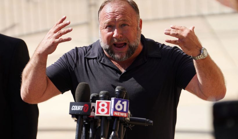WATERBURY, CONNECTICUT - SEPTEMBER 21: InfoWars founder Alex Jones speaks to the media outside Waterbury Superior Court during his trial on September 21, 2022 in Waterbury, Connecticut. Jones is being sued by several victims' families for causing emotional and psychological harm after they lost their children in the Sandy Hook massacre. A Texas jury last month ordered Jones to pay $49.3 million to the parents of 6-year-old Jesse Lewis, one of 26 students and teachers killed in the shooting in Newtown, Connecticut. (Photo by Joe Buglewicz/Getty Images)