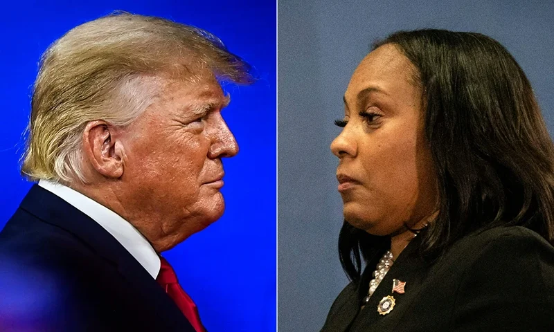 (COMBO) This combination of pictures created on August 14, 2023 shows Former US President Donald Trump in Orlando, Florida, on February 26, 2022 and Fulton County District Attorney Fani Willis on August 14, 2023, in Atlanta, Georgia. The Georgia prosecutor who brought sweeping charges against former president Donald Trump and 18 other defendants said Monday, August 14, that she wants to hold their trial "within the next six months." Fulton County District Attorney Fani Willis said arrest warrants had been issued for Trump and the others charged over their efforts to overturn the 2020 election and they had until August 25 to "voluntarily surrender." (Photo by CHANDAN KHANNA and Christian MONTERROSA / AFP) (Photo by CHANDAN KHANNA,CHRISTIAN MONTERROSA/AFP via Getty Images)