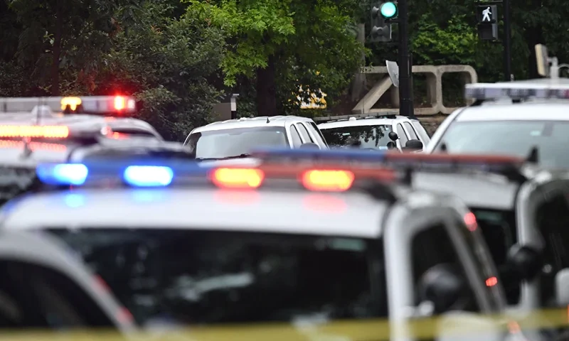 US-CRIME-THREAT-EVACUATION-ANIMAL-ZOO Police block off a road near the National Zoo in Washington, DC, on August 29, 2023, after a bomb threat caused the zoo to be evacuated. (Photo by Andrew Caballero-Reynolds / AFP) (Photo by ANDREW CABALLERO-REYNOLDS/AFP via Getty Images)