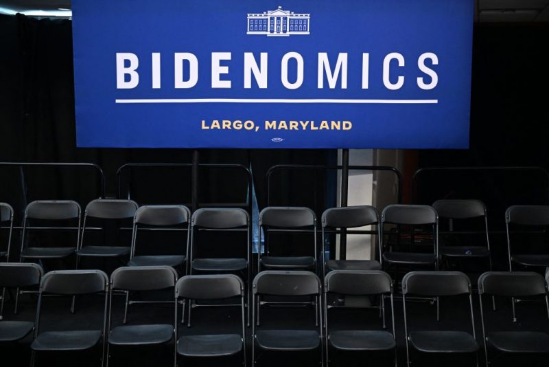 Empty chairs are pictured under a "Bidenomics" sign after US President Joe Biden delivered remarks on his economic agenda at Prince George's Community College in Largo, Maryland, on September 14, 2023. (Photo by Jim WATSON / AFP) (Photo by JIM WATSON/AFP via Getty Images)